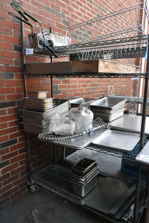 Green Finish 4 Tier Wire Shelving Unit on Commercial Casters w/ Contents including Baskets, Stainless Steel Drop In Bins and Metal Baking Pans. BUYER MUST DISMANTLE. PCI CANNOT DISMANTLE FOR SHIPPING. PLEASE CONSIDER FREIGHT CHARGES. - Image 1 of 8