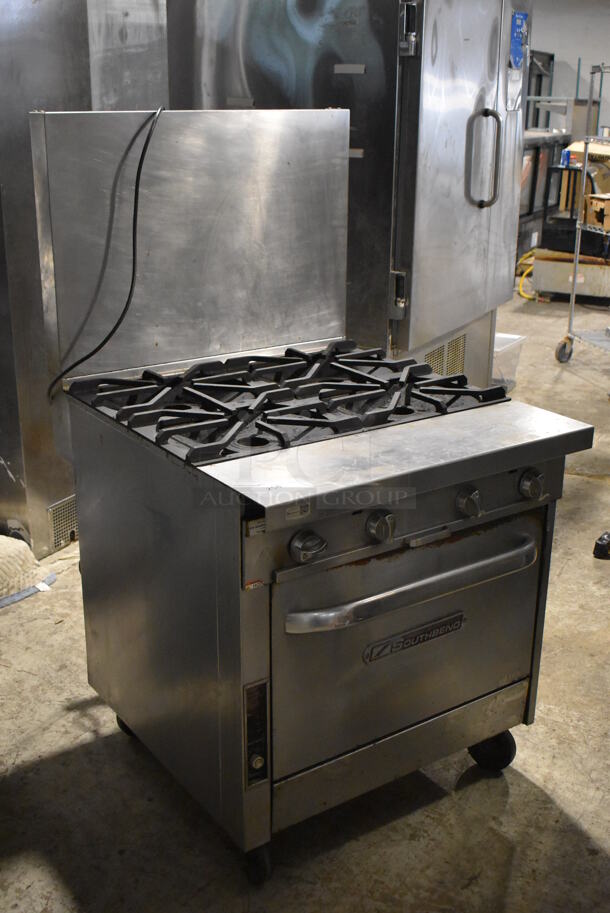 Southbend Stainless Steel Commercial Natural Gas Powered 4 Burner Range w/ Convection Oven and Back Splash on Commercial Casters. - Image 2 of 5