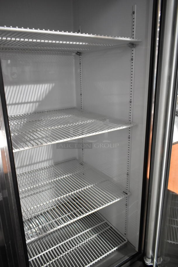 True T-72G Stainless Steel Commercial 3 Door Reach In Cooler Merchandiser w/ Poly Coated Racks on Commercial Casters. 115 Volts, 1 Phase. Tested and Working! - Image 6 of 9