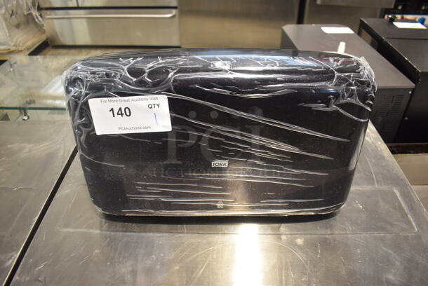 NEW Tork Black Poly Wall Mount Toilet Paper Dispenser. - Image 1 of 4