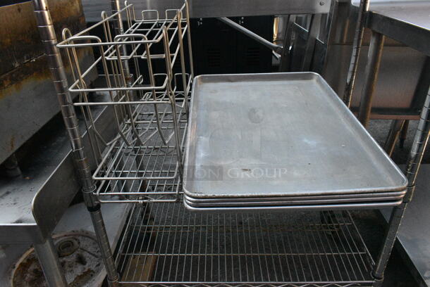 Chrome Finish 5 Tier Wire Shelving Unit on Commercial Casters w/ Contents Including Metal Baking Pans, Basket. Missing Wheel. BUYER MUST DISMANTLE. PCI CANNOT DISMANTLE FOR SHIPPING. PLEASE CONSIDER FREIGHT CHARGES. - Image 8 of 8