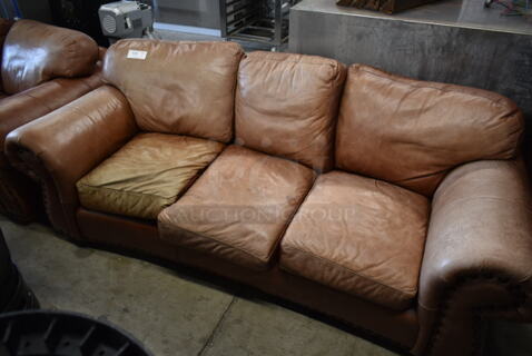 Brown 3 Seat Couch w/ Arm Rests.