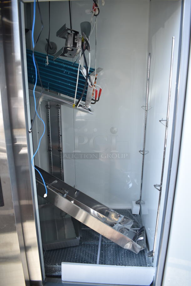 BRAND NEW SCRATCH AND DENT! 2024 Avantco 178A49FHC Stainless Steel Commercial 2 Door Reach In Freezer w/ Poly Coated Racks on Commercial Casters. 115 Volts, 1 Phase. Cannot Test - Interior Pieces are Detached - Image 6 of 9