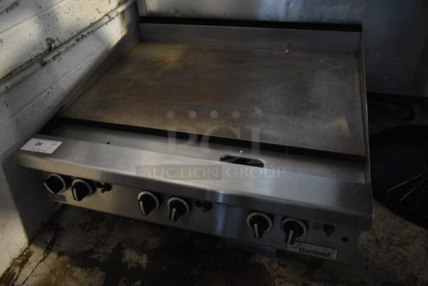 Garland Stainless Steel Commercial Countertop Natural Gas Powered Flat Top Griddle.