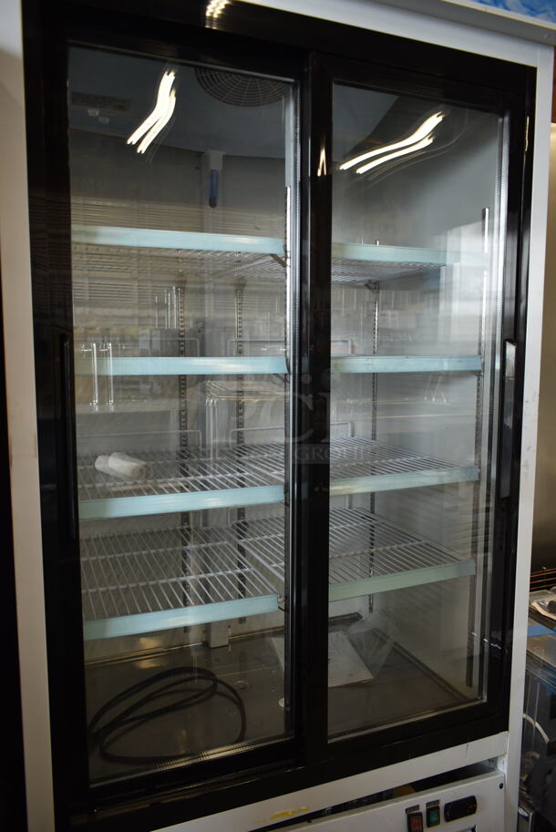BRAND NEW SCRATCH AND DENT! 2023 Avantco 178GDS33HCW Metal Commercial 2 Door Reach In Cooler Merchandiser w/ Poly Coated Racks on Commercial Casters. 115 Volts, 1 Phase. Cannot Test Due To Cut Power Cord - Image 3 of 9