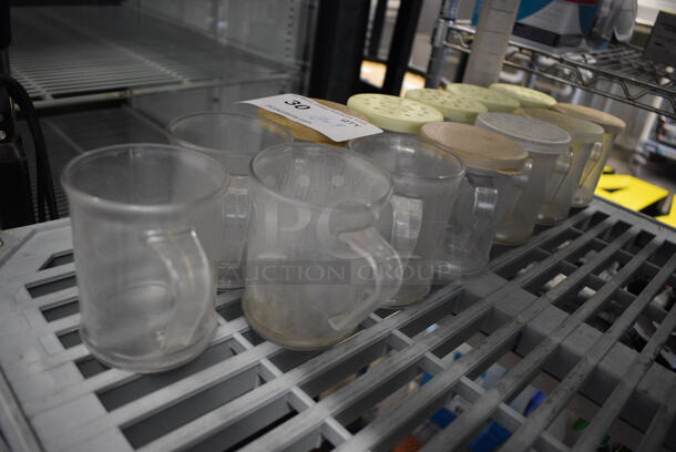ALL ONE MONEY! Lot of 13 Clear Poly Seasoning Shakers w/ 9 Lids. 4x3x3.5 - Image 3 of 3