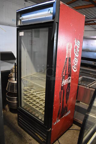 True GDM-26 Metal Commercial Single Door Reach In Cooler Merchandiser w/ Poly Coated Racks. 115 Volts, 1 Phase. 30x31x79. Tested and Powers On But Temps at 53 Degrees