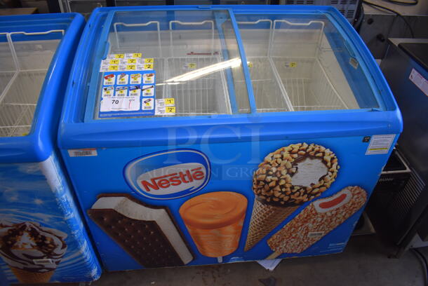 AHT RIO S 100 Metal Commercial Novelty Ice Cream Freezer Merchandiser on Commercial Casters. 110-120 Volts, 1 Phase. 39x25x35. Tested and Working!