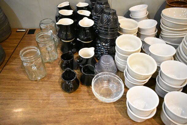 Wood Pattern Dining Height Table w/ Contents Including Ceramic Bowls, Cream Pitchers and Poly Bowls. (main dining room) - Image 3 of 3