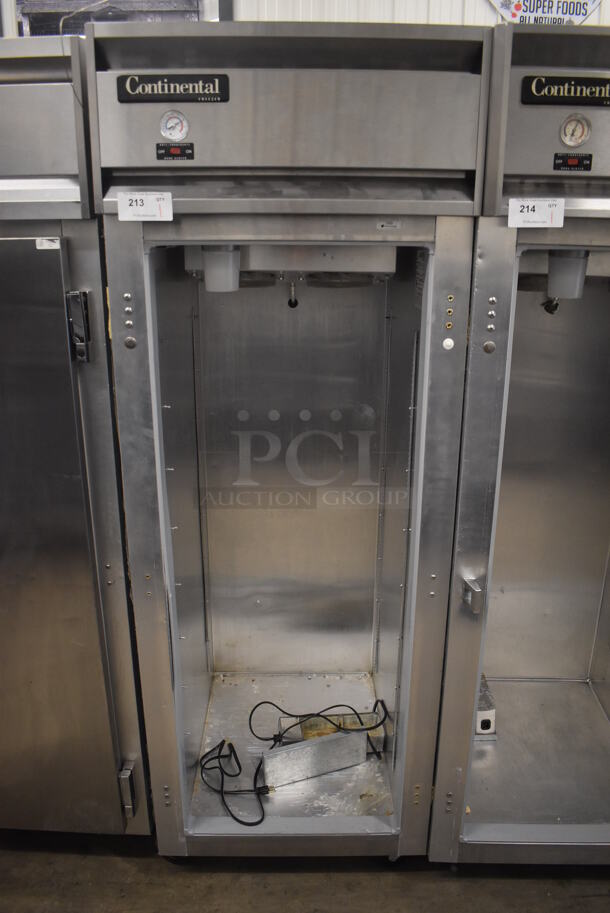 Continental 1FE Stainless Steel Commercial Single Door Reach In Freezer on Commercial Casters. Missing Door. 115 Volts, 1 Phase. 28.5x36x77.5. Tested and Powers On But Temps at 46 Degrees