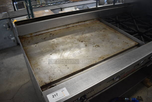 	Blodgett Stainless Steel Commercial Natural Gas Powered Flat Top Griddle w/ 4 Burner Range, Gas Hose and Under Shelf on Commercial Casters. One Caster Needs To Be Reattached. 60x31x43 - Image 3 of 7