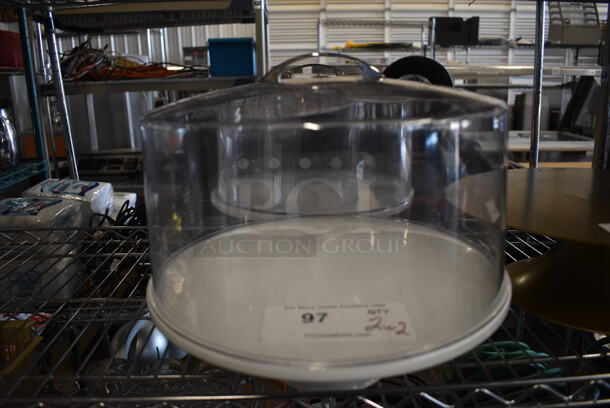 2 White Ceramic Cake Stands w/ Clear Poly Dome Covers. 12.5x12.5x4, 11x11x8. 2 Times Your Bid! - Image 1 of 3