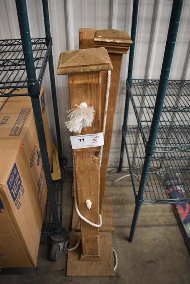 3 Wooden Stanchions w/ Rope. 10x10x44. 3 Times Your Bid!