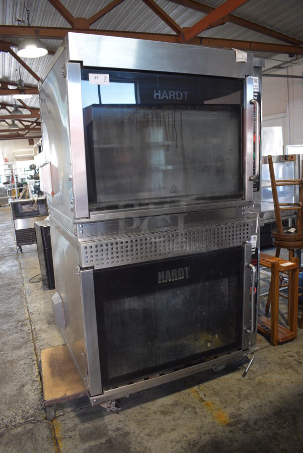 2 Hardt Model Inferno 3500 Stainless Steel Commercial Natural Gas Powered Rotisserie Ovens on Commercial Casters. Each Oven Has a 40 Bird Capacity. 50x50x80. 2 Times Your Bid!
