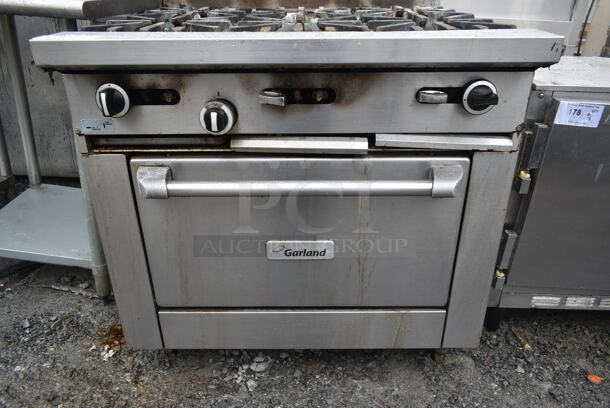 Garland G36-6R Stainless Steel Commercial Natural Gas Powered 6 Burner Range w/ Oven and Back Splash.  - Image 4 of 8