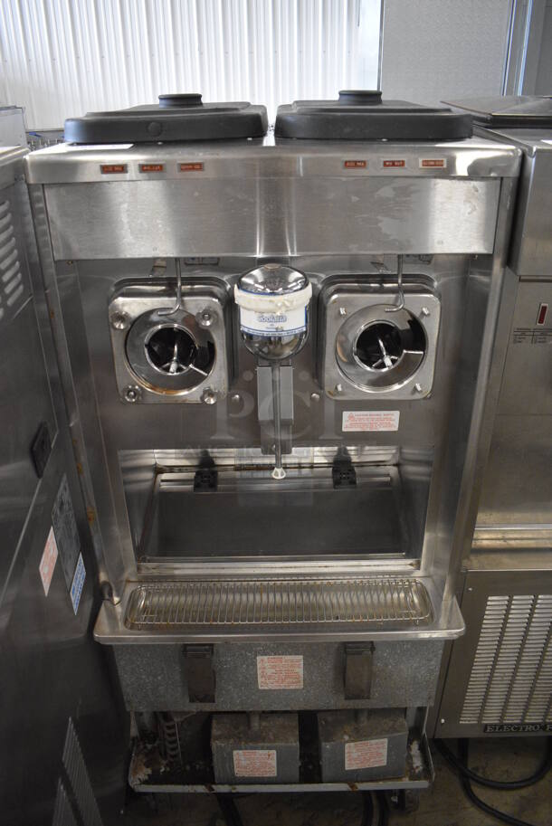 Taylor Model 342D-27 Stainless Steel Commercial Floor Style Air Cooled 2 Flavor Frozen Beverage Machine w/ Drink Mixer Attachment on Commercial Casters. Missing Pieces. 208-230 Volts, 1 Phase. 26x34x60