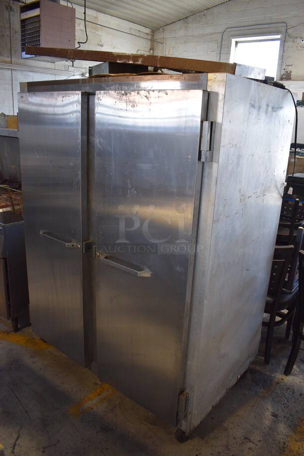 Continental 2F Stainless Steel Commercial 2 Door Reach In Freezer on Commercial Casters. Unit Does Not Come w/ Compressor. 115 Volts, 1 Phase. 52x36x71