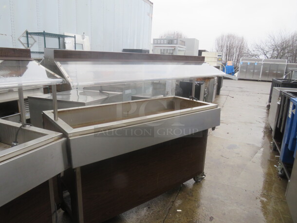 One Stainless Steel Refrigerated Cold  Well With Sneeze Guards On Casters. 58X34X54