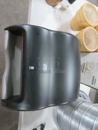 One Tork Paper Towel Dispenser.
