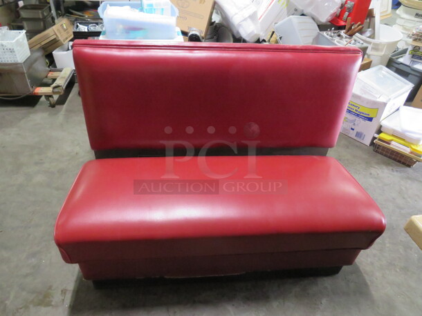 One Single Sided Booth With Red Cushioned Seat And Back. 48X26X36