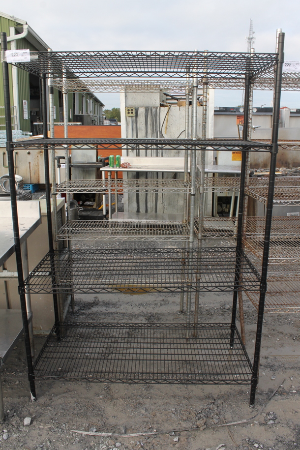 Black Finish 4 Tier Wire Shelving Unit. BUYER MUST DISMANTLE. PCI CANNOT DISMANTLE FOR SHIPPING. PLEASE CONSIDER FREIGHT CHARGES. - Image 1 of 3