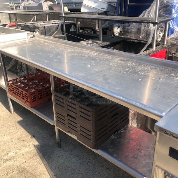 One Stainless Steel Table With Stainless Under Shelf, And Back Splash. 84X24X37. TABLE ONLY!