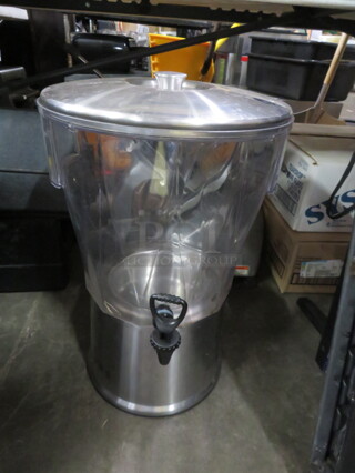 One Beverage Dispenser With Stainless Steel Base And Lid. 