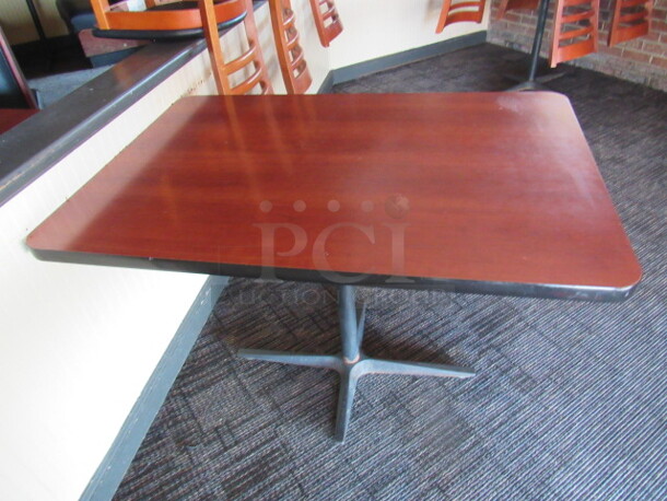 One Table With Laminate Top On A Pedestal Base. 44X30X30