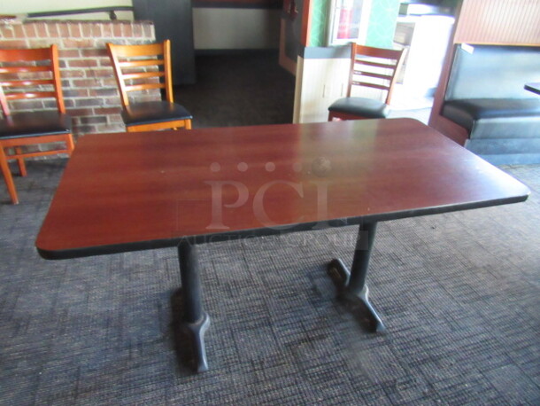 One Table With Laminate Top On A Dual Pedestal Base. 60X30X30