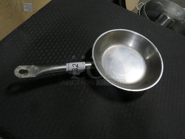 One 9 Inch Stainless Steel Saute Pan.