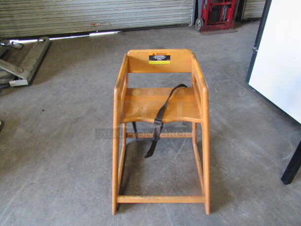 One Wooden High Chair.