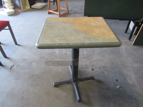 One Green/Brown Laminate Table Top On A Pedestal Base. 20X24X30