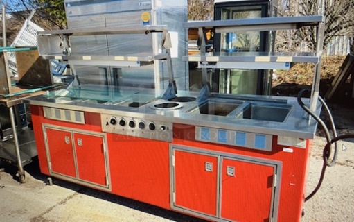 One Delfield 5 Well Steam Table With 4 SS Overshelves With Hatco Warmers, 4 Doors Under With Storage, And Sneeze Guards On Casters. Model# KH-6-NU. 240 Volt. 96X38X60