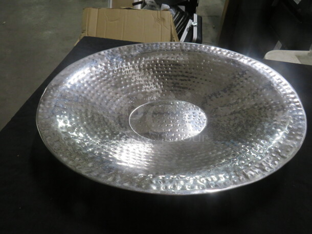 One 19X15 Oval Hammered Serving Bowl.