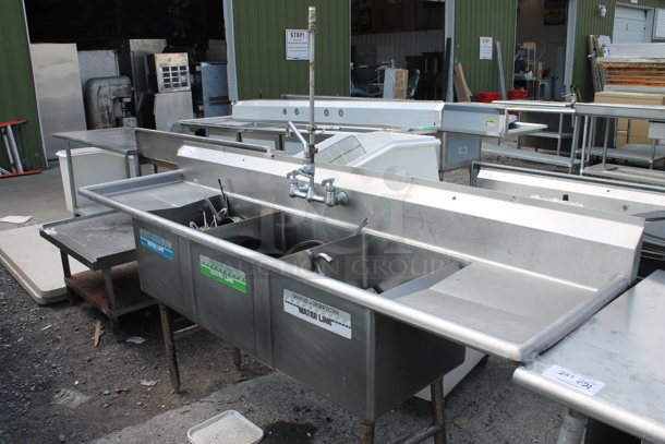 Stainless Steel Commercial 3 Bay Sink w/ Dual Drain Boards, Faucet and Handles. Comes w/ Contents! Bays 18x18. Drain Boards 16.5x20.5 - Image 1 of 10