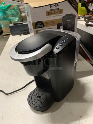 One Kuerig Coffee Brewer.