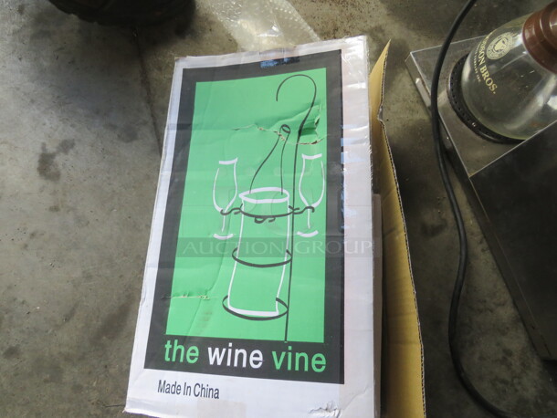 One NEW Metal Wine Vine. - Image 1 of 2
