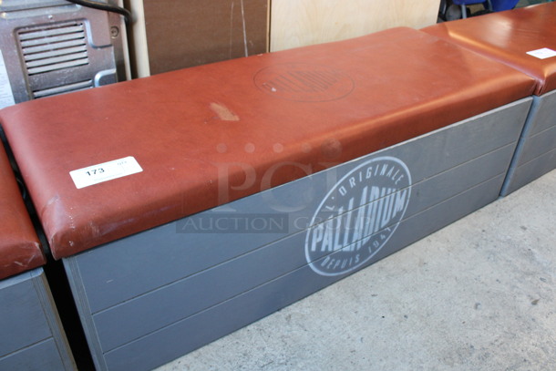 Gray Wooden Booth Bench w/ Red Cushion and Palladium Logo. 48x18x15