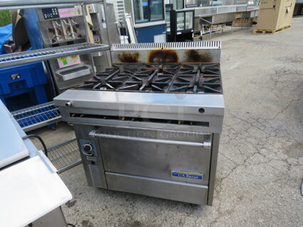 One US Range 6 Burner Natural Gas Range On Casters. Model# C836-6RC. 36X37X41. $8106.00.