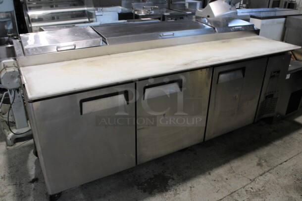 2015 Sun Ice Model SUN-PT-83 Stainless Steel Commercial Pizza Prep Table w/ 3 Lids and 3 Doors on Commercial Casters. 115 Volts, 1 Phase. 93x36x44. Tested and Powers On But Temps at 41 Degrees