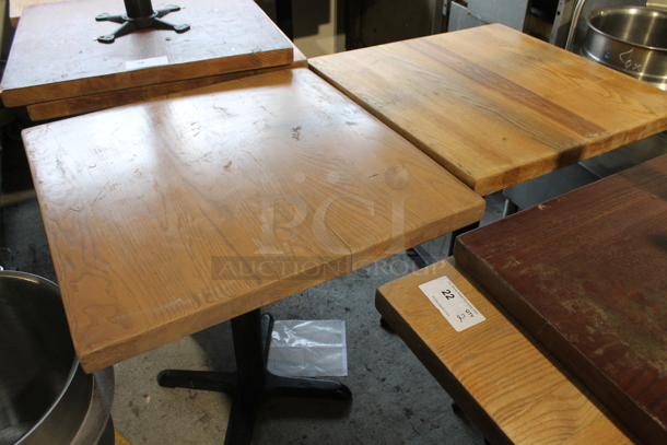 2 Wooden Dining Height Tables on Black Metal Table Base. 2 Times Your Bid! - Image 1 of 3