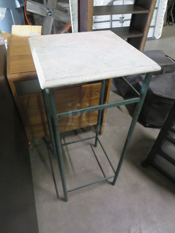 One Metal Table With A Granite Top. 15X15X35