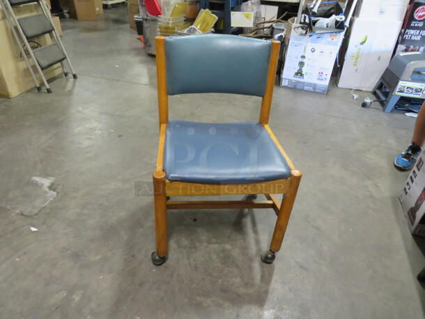 Wooden Chair With Green/Blue Cushioned Seat And Back, On Casters. 4XBID