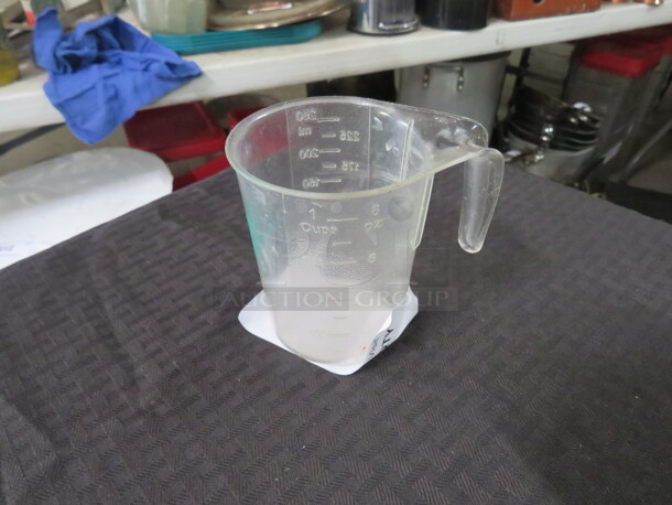 One 1 Cup Measurer.  - Image 1 of 1