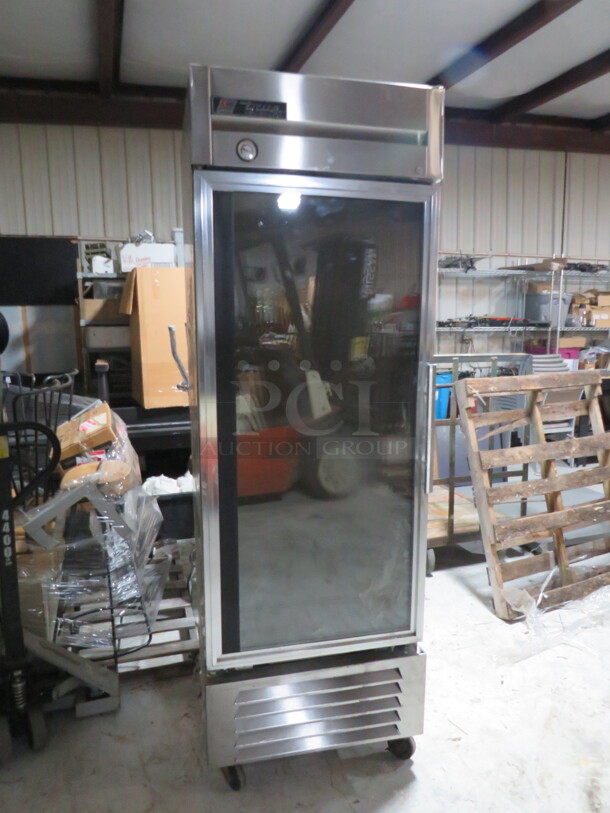 One WORKING True Glass Door refrigerator With 3 Racks On Casters. Model# T-23G. 115 Volt. 27X30X82. $4244.40. - Image 1 of 3