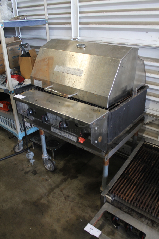 MagiCater Stainless Steel Commercial Floor Style Propane Gas Powered Charbroiler Grill w/ Rolling Lid on Commercial Casters.  - Image 1 of 5
