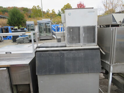 One Hoshizaki Ice Maker And Bin On Casters.  Model# F-1001MAH. 115-208/230 Volt. 44X37X69