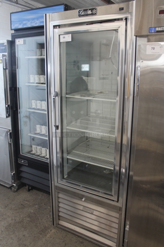 2015 Leader PF30 SC Stainless Steel Commercial Single Door Reach In Cooler Merchandiser w/ Poly Coated Racks. 115 Volts, 1 Phase. Tested and Powers On But Does Not Get Cold