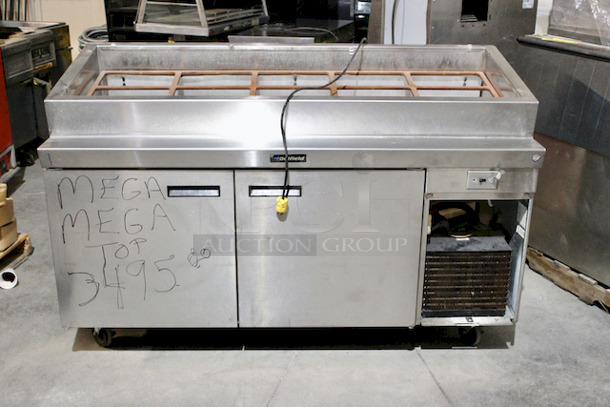 NICE! Delfield  70” PTB Pizza Prep Table With Mega Top, Self Contained Refrigerated Base With 27.12” DP, Bloomington Cold Rail & Template.
Tested - In Working Order.
115v/60hz/1ph/12.0A  