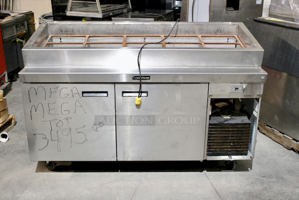 NICE! Delfield  70” PTB Pizza Prep Table With Mega Top, Self Contained Refrigerated Base With 27.12” DP, Bloomington Cold Rail & Template.
Tested - In Working Order.
115v/60hz/1ph/12.0A   - Image 1 of 7